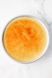 Cooked cheesecake flan (flan de queso) after removing from oven and water bath.